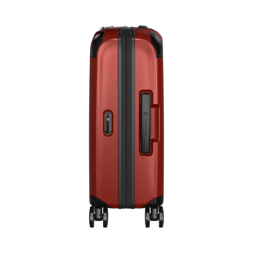 Red hardshell rolling suitcase with black trim and wheels.