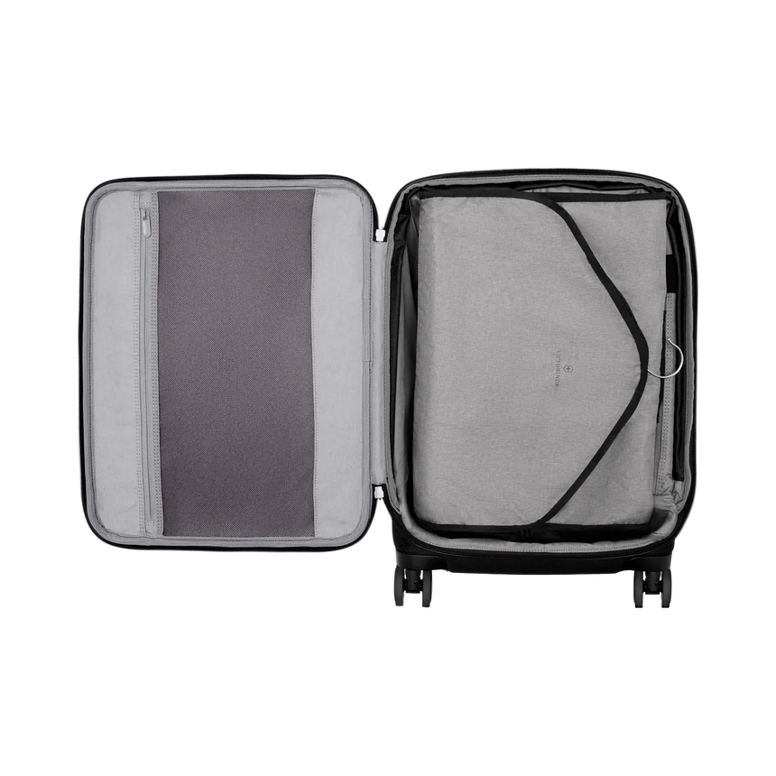 Open suitcase with two compartments, one zippered and one with elastic straps.