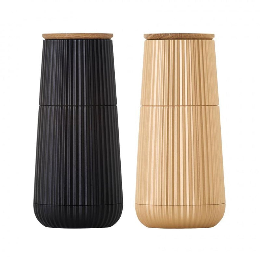 Two tall, cylindrical vases with ribbed textures and wooden lids in black and beige colors.
