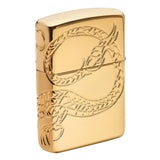 Gold-colored Zippo lighter with an engraved dragon design.