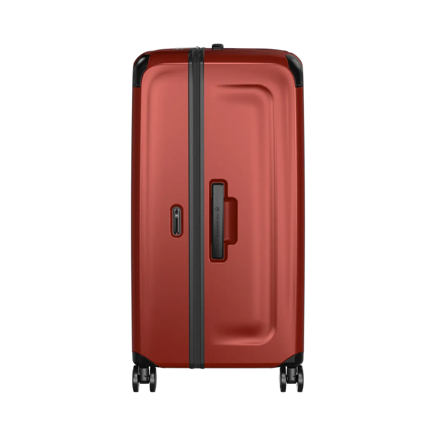 Red hardshell rolling suitcase with black trim and wheels.