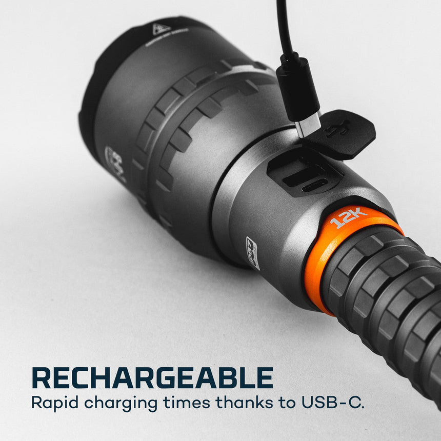 Rechargeable flashlight with USB-C charging capability and an orange accent ring.