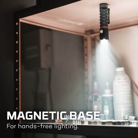 Flashlight with a magnetic base attached to a metal surface.