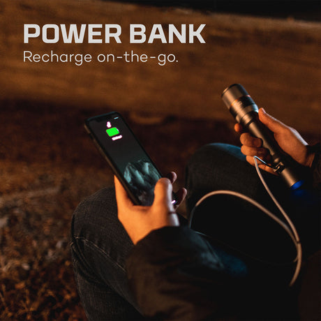 Power bank connected to a smartphone for charging on-the-go.