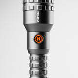 Sleek, metallic flashlight with an orange ’N’ logo and multiple adjustment rings.