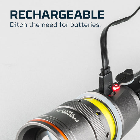 Rechargeable flashlight with a USB charging cable attached.