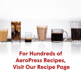 A lineup of various coffee drinks in clear glasses and mugs.