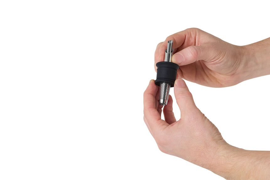 Screwdriver being held between two hands.