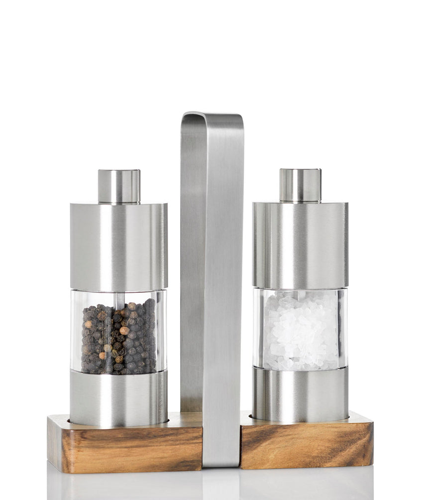 Salt and pepper grinder set with a stainless steel and wood base.