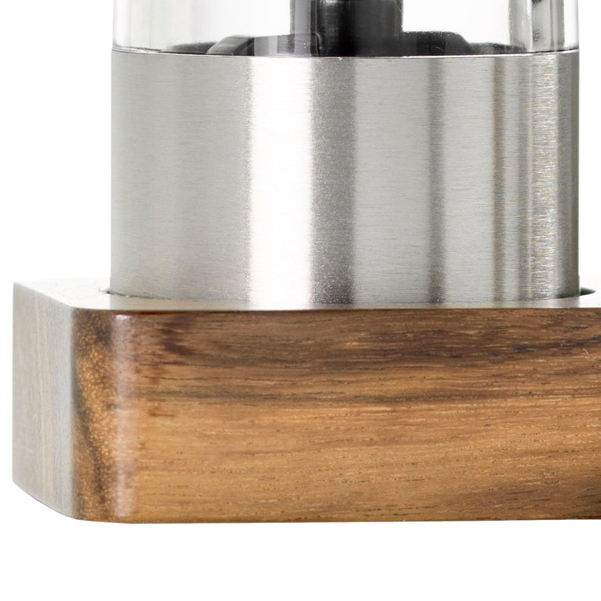Stainless steel appliance or container with a wooden base.