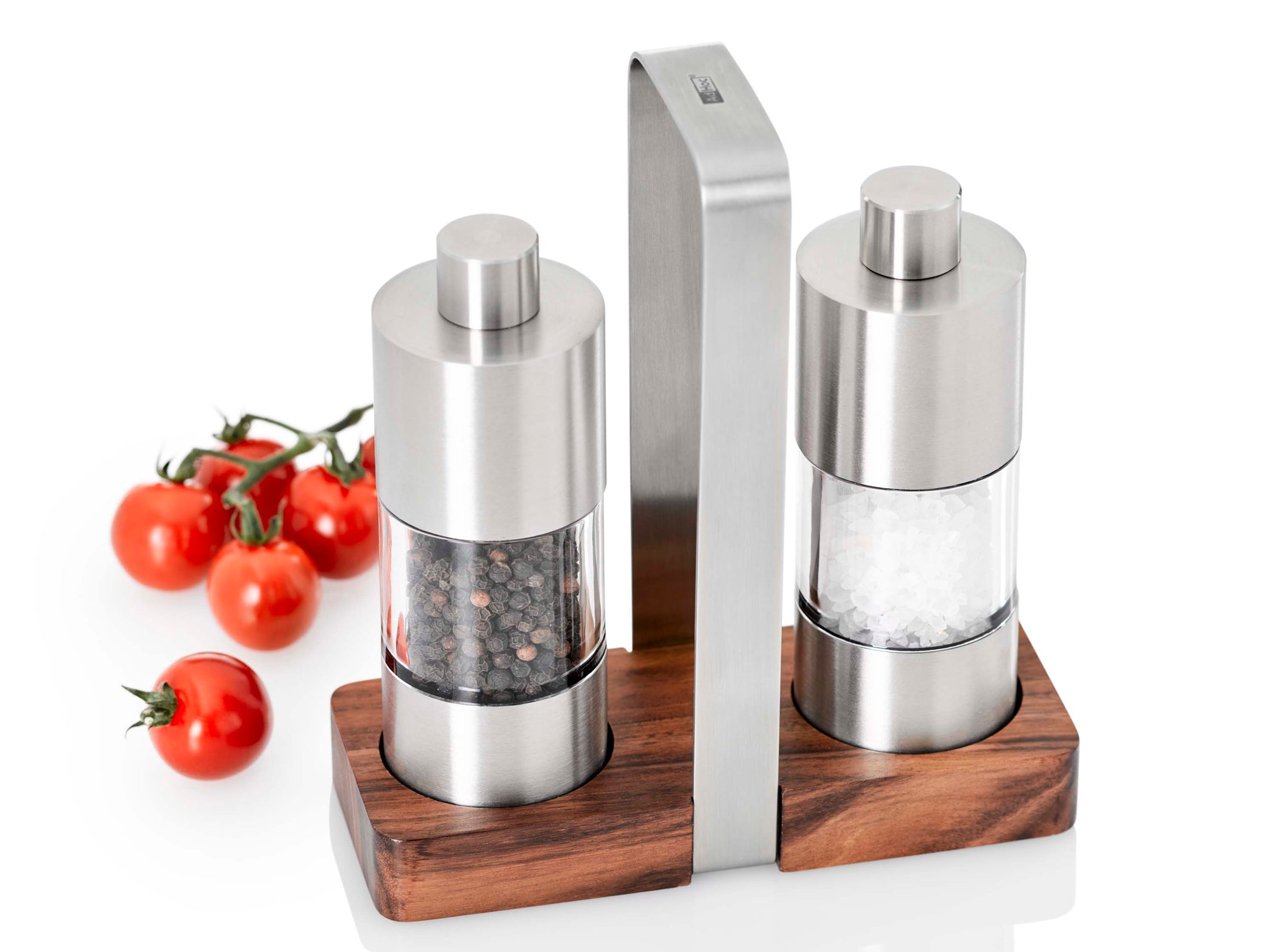 Salt and pepper grinder set with wooden base and metal handle.