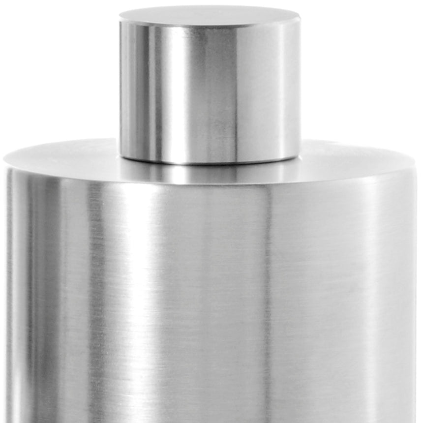 Cylindrical metal container with a smaller cylindrical cap on top.