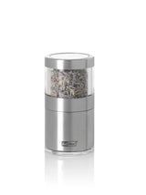 Stainless steel and glass salt or pepper grinder with visible spices inside.