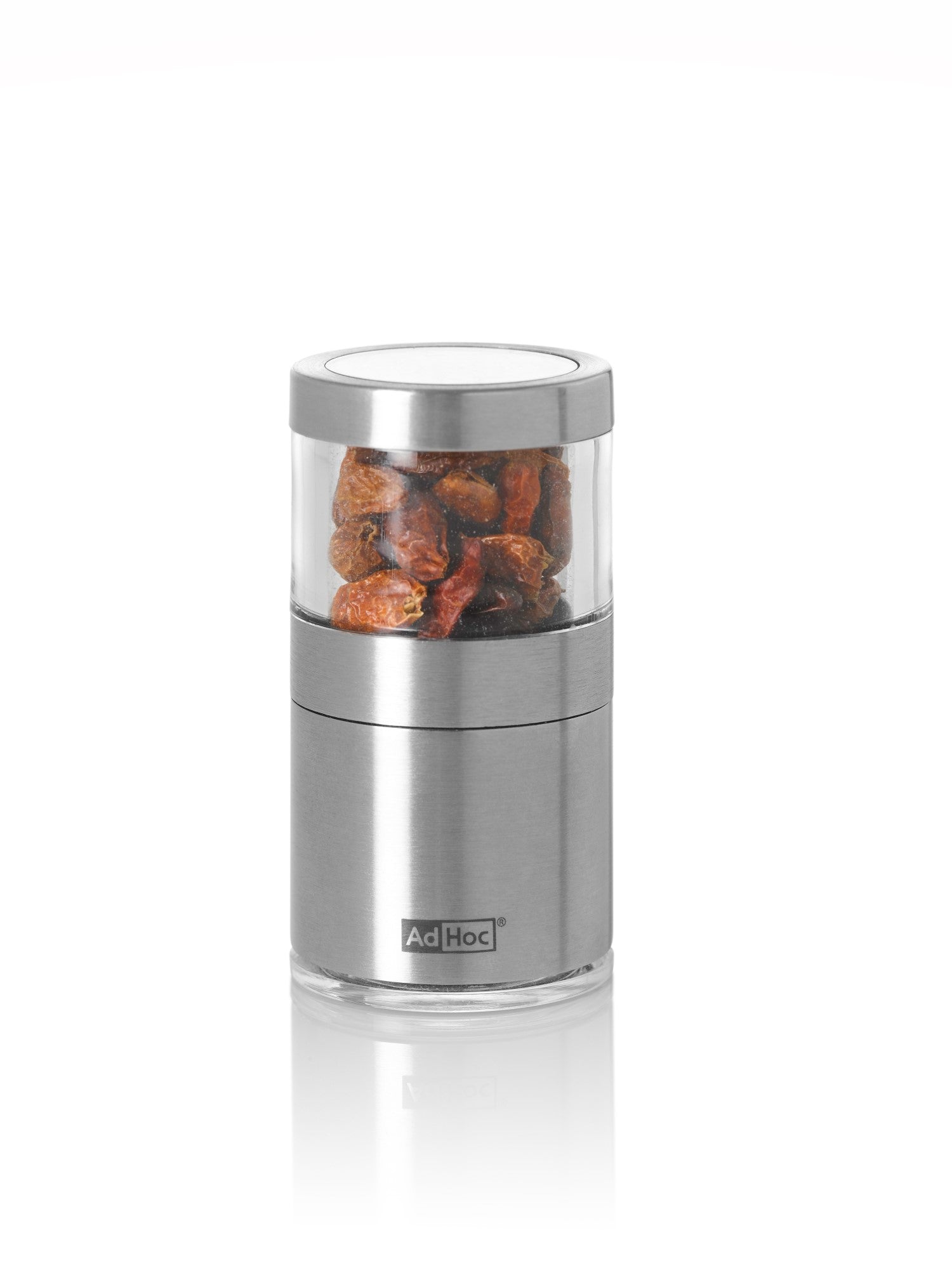 Stainless steel spice grinder with visible peppercorns in the clear top chamber.