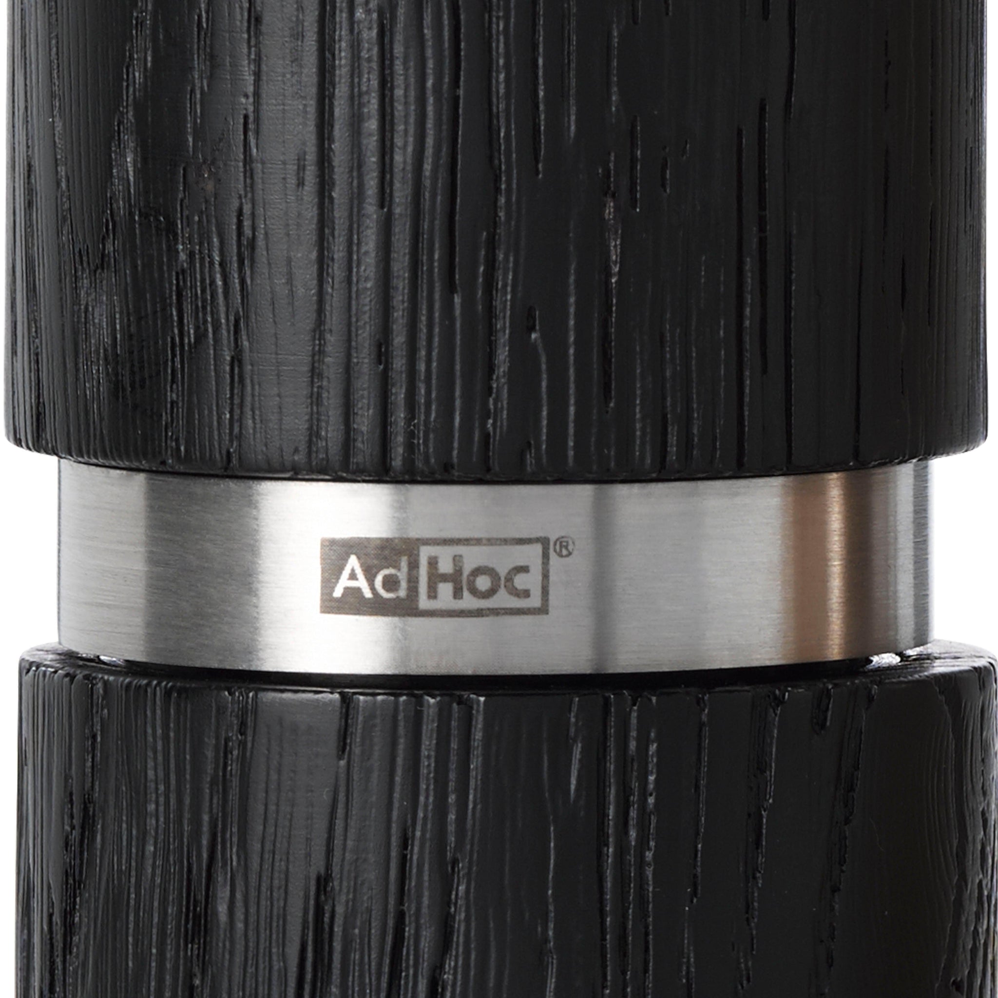 Sleek black and stainless steel pepper mill or grinder with ’AdHoc’ branding.