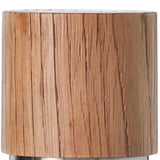 Cylindrical wooden object with visible grain and a metallic base.