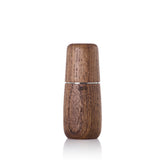 Wooden pepper or salt mill with a rounded shape and visible grain texture.