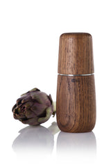 Wooden pepper mill or spice grinder with a smooth, cylindrical shape.