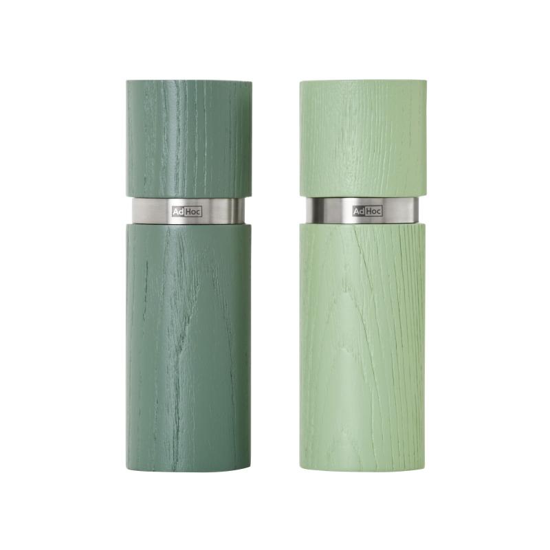 Two cylindrical salt and pepper mills in muted green colors with metallic bands.