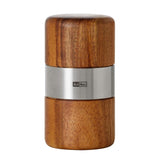 Wooden salt or pepper grinder with a metallic band around the middle.