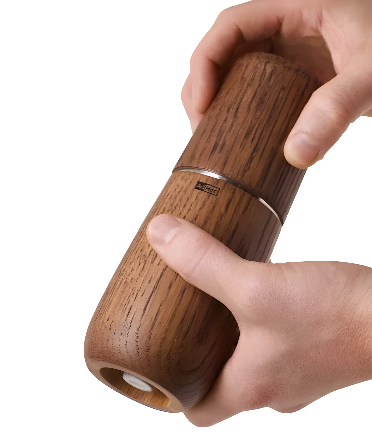 Wooden pepper or spice grinder held by hands.