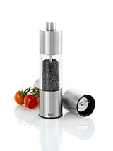 Stainless steel and glass pepper mill with visible peppercorns inside.