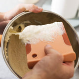 Foam-covered paint roller applying paint to a wall.
