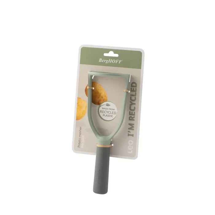 Handheld potato peeler in gray and green packaging.