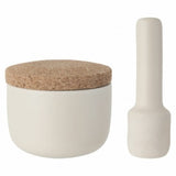 White ceramic container with a cork lid, accompanied by a matching pestle.